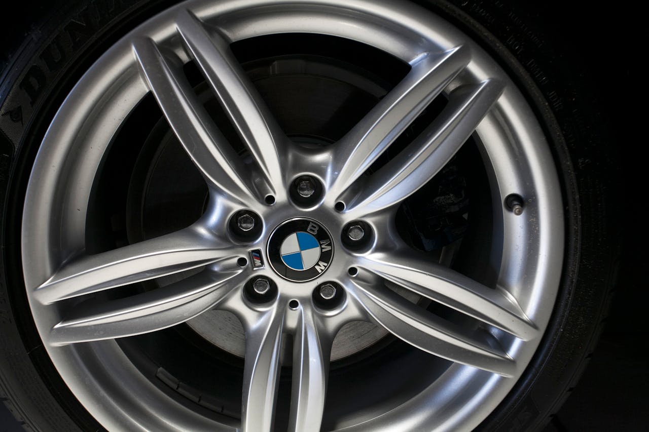High-resolution close-up of a BMW alloy wheel rim showing detailed design and branding.