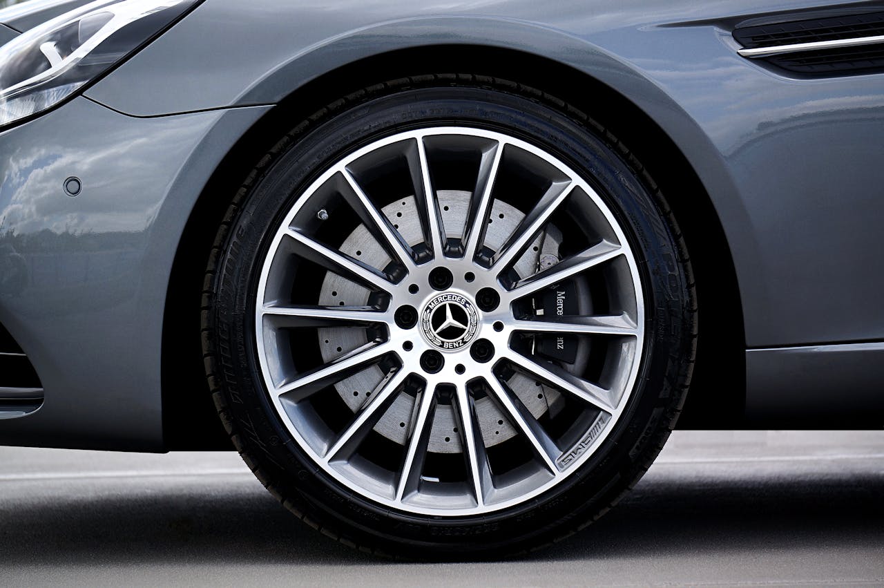 Detailed view of a Mercedes-Benz car tire and alloy wheel. Premium automotive design.